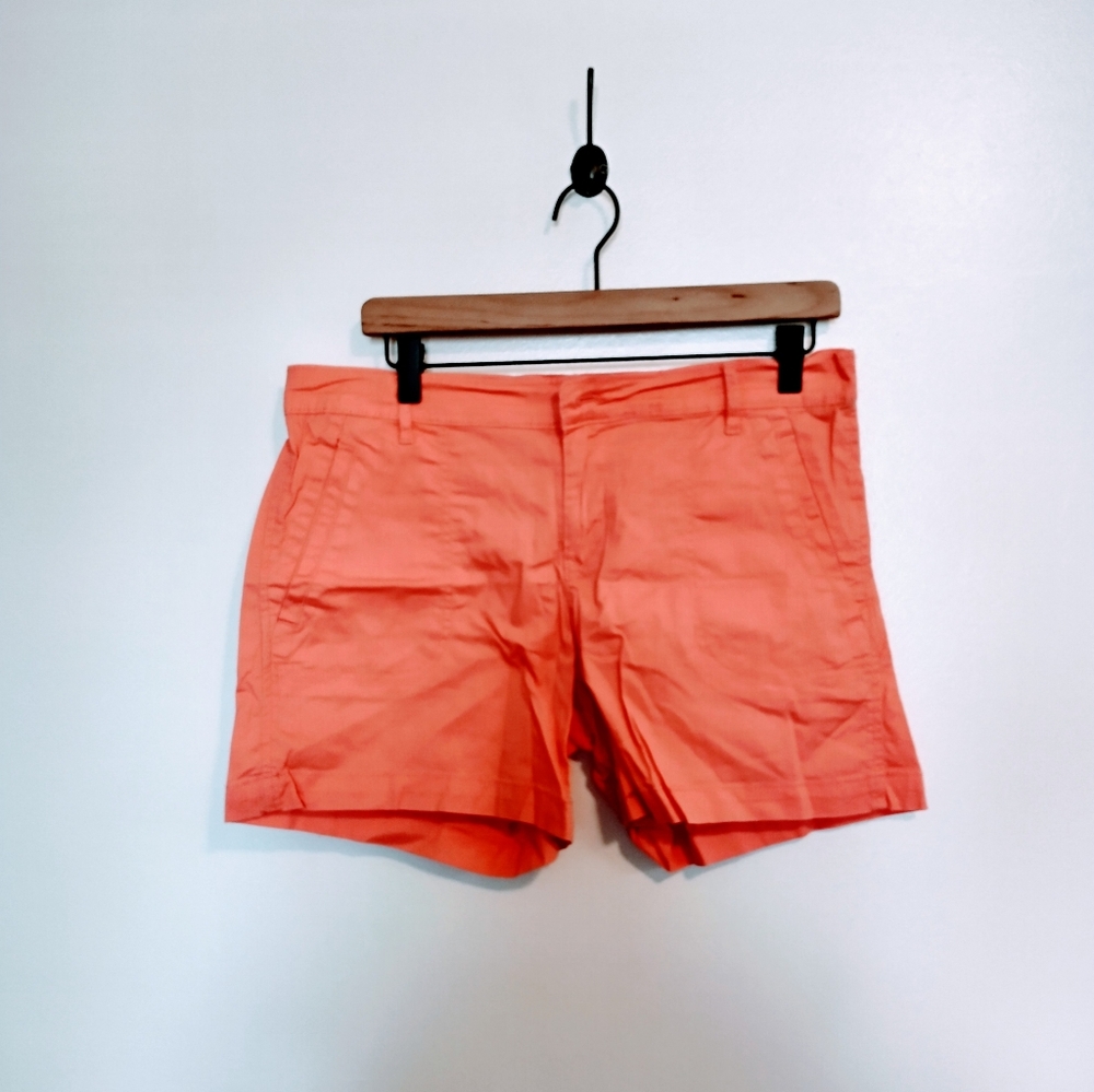 Calvin Klein Jeans orange shorts size 8. Longer inseam, missing front button